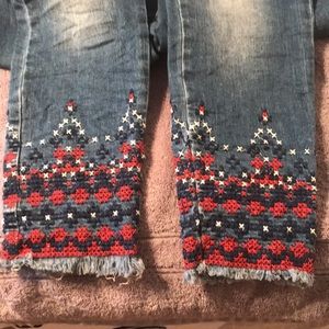 Woman’s Jeans with embroidered bottoms.Size Small.